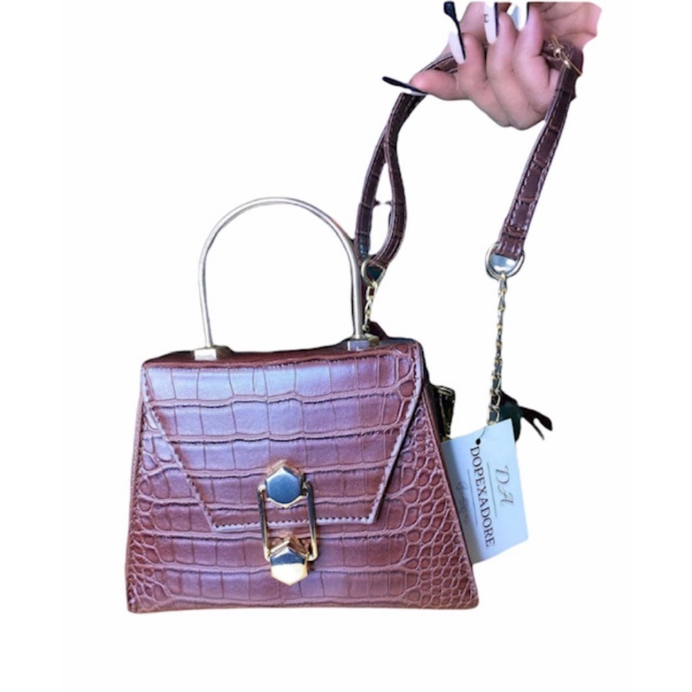 Brown hand bag .